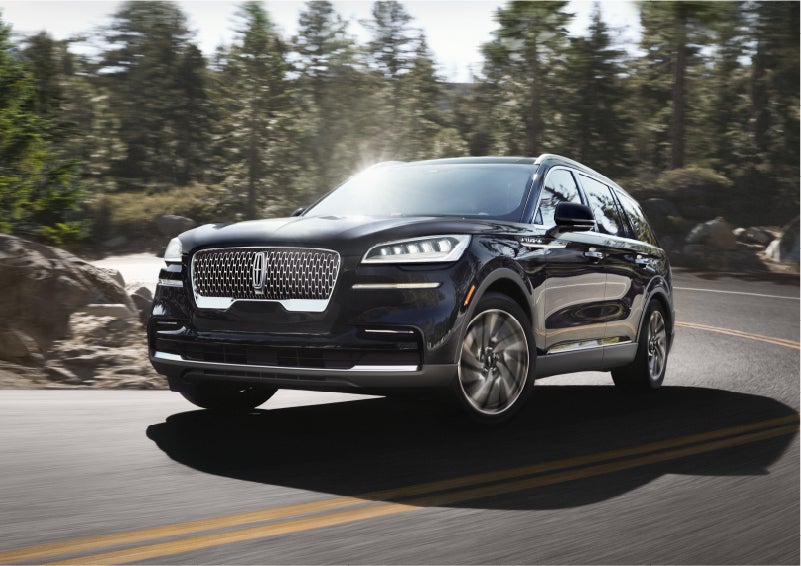 A Lincoln Aviator® SUV is being driven on a winding mountain road | Gates Lincoln in Richmond KY