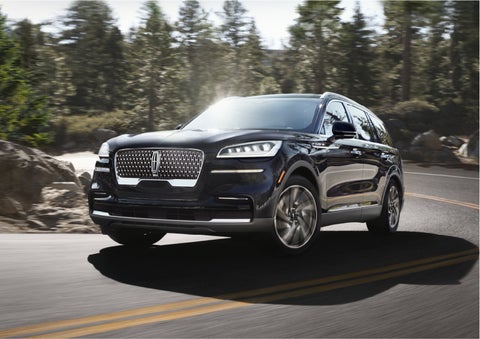 A Lincoln Aviator® SUV is being driven on a winding mountain road | Gates Lincoln in Richmond KY