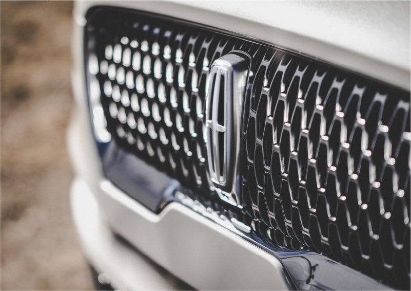 The grille of the 2023 Lincoln Aviator® Reserve model with an eye-catching repeated field of Lincoln Star logo shapes | Gates Lincoln in Richmond KY