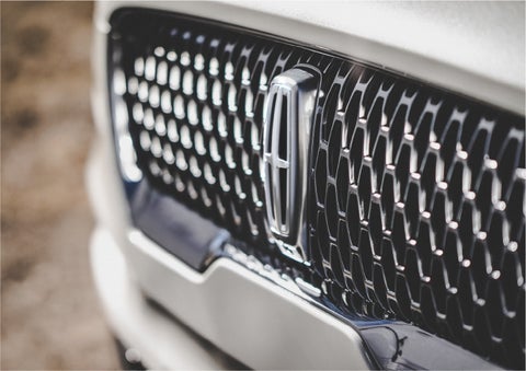 The grille of the 2023 Lincoln Aviator® Reserve model with an eye-catching repeated field of Lincoln Star logo shapes | Gates Lincoln in Richmond KY