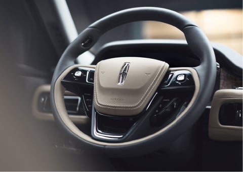 The intuitively placed controls of the steering wheel on a 2023 Lincoln Aviator® SUV | Gates Lincoln in Richmond KY