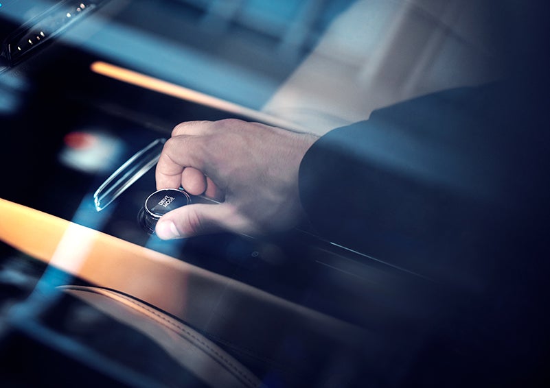 The driver of a 2023 Lincoln Corsair® SUV is shown adjusting the drive mode. | Gates Lincoln in Richmond KY