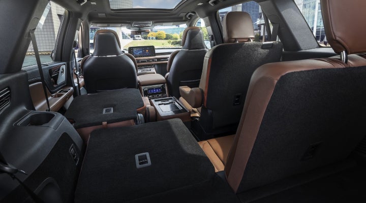 One side of the PowerFold® third-row seat and a second-row seat are folded forward in the 2026 Lincoln Aviator® SUV. | Gates Lincoln in Richmond KY