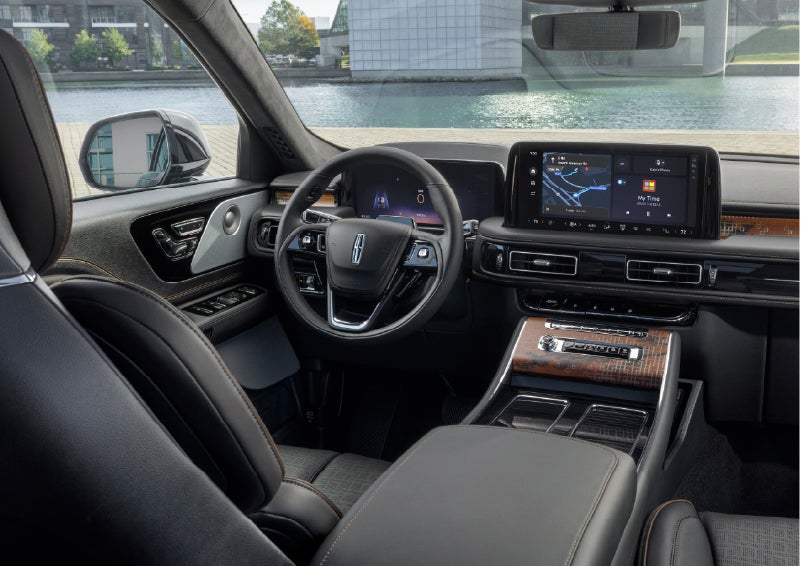 The interior of the 2026 Lincoln Aviator® SUV is shown parked with a view of a harbor through the windshield. | Gates Lincoln in Richmond KY