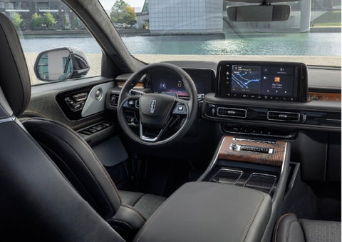 The interior of the 2026 Lincoln Aviator® SUV is shown parked with a view of a harbor through the windshield. | Gates Lincoln in Richmond KY