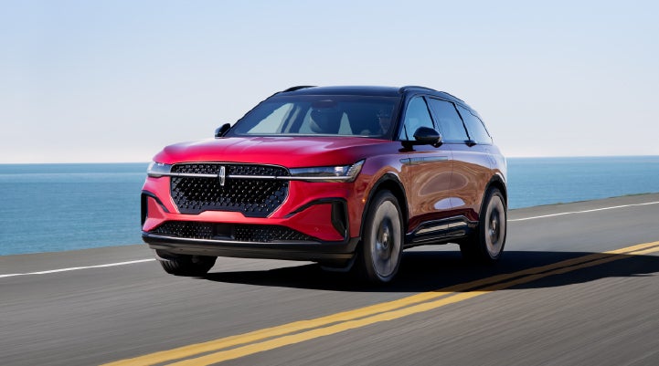 A 2026 Lincoln Nautilus® SUV is being driven on a seaside roadway. | Gates Lincoln in Richmond KY