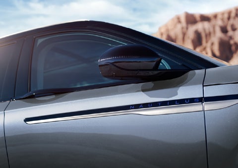 Blue lettering on the side of the vehicle that reads Nautilus indicates the available Hybrid Powertrain. | Gates Lincoln in Richmond KY